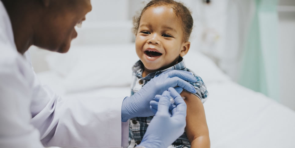 Toddler getting vaccination by pediatrician